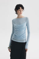 Sky blue sheer ruched long sleeve top with minimalist draped front
