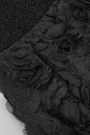 Close-up of a black sheer floral fabric with layered rosette petals and a textured black mesh section of VOGSION Noire Rosalie Glitter Rose Mermaid Maxi Dress