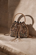 VOGSION VS Beaded Bucket Bag luxury crystal bucket handbag photographed outdoors in natural sunlight