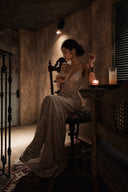 Editorial portrait of the Vogsion Nocturne Sculpted Sequin Maxi Gown featuring sparkling sequin fabric, sculpted fit and elegant evening styling. Perfect formal gown for galas, luxury weddings, evening parties and black tie occasions.