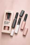 Vogsion PocketLift Mini Heated Brush shown in black, white, and blush pink colorways with packaging, designed as a travel-size heated brush for bangs, flat roots, and quick styling touch-ups.