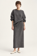 Charcoal grey Aderyn wool-blend sweater and high-waist midi skirt set, front view with a partial tuck