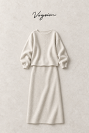 Ivory wool-blend top and midi skirt flat lay on a textured ivory background with Vogsion wordmark