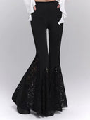 Black lace flare pants with fitted upper leg and cross detail close-up