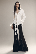 Women's black lace flare pants with dramatic Gothic bell-bottom legs front view