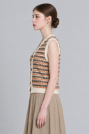 Fair Isle button knit vest in warm rust and cream, side view