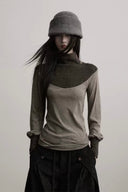 Indulge Ravena taupe and charcoal wool-knit top, front view with curved panel and shoulder buttons