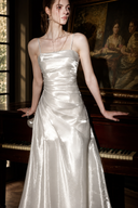 Close-up of the Isabeau ivory dress showing the straight folded neckline and ruched satin bodice.