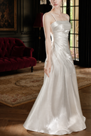 Side view of the Isabeau ivory satin maxi dress highlighting the gathered waist and flowing A-line skirt.