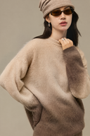 Close-up of beige-to-brown ombre wool cashmere crew neck sweater with fuzzy knit texture