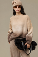Oversized latte and mocha gradient wool cashmere sweater styled with brown trousers