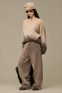 Oversized beige and brown ombre sweater styled with tonal trousers