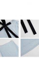 Detail collage of black halter tie, strap ends, light blue waistband and textured fabric