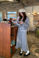 Full-length view of petite grey wool-blend faux-layer knit cardigan and A-line maxi skirt set