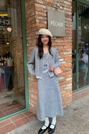 Front view of petite grey wool-blend faux-layer knit cardigan and long A-line skirt set