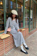Petite grey wool-blend cardigan and A-line knit skirt set styled outdoors with beret