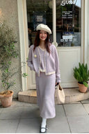 Full-length view of petite soft lilac wool-blend cardigan and A-line knit skirt matching set