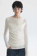 White sheer long sleeve top with soft ruching and relaxed sleeve length