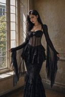 Close view of black Gothic dress sheer polka-dot corset waist and long draped bell sleeves