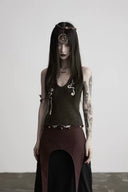 Model wearing the Naga dark brown serpent-embroidered wool knit halter top in a centered front view