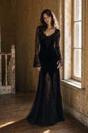 Black Gothic prom maxi dress with integrated lace sleeves by a sunlit window