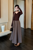 Full-length view of the Odette petite V-neck top and polka dot maxi skirt set in chocolate and taupe.