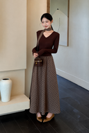 Front view of the Odette petite two-piece set with a chocolate V-neck top, taupe polka dot maxi skirt and matching ribbon.