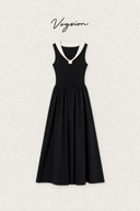 Black cotton knit midi dress with an ivory collar, rosette detail and gathered A-line skirt, available in petite sizing.