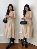 Two model views of a beige cotton knit midi dress with tonal flower collar and gathered skirt.
