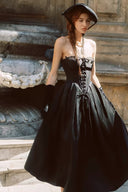 Black vintage corset dress on model outdoors
