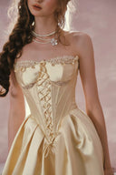 Champagne gold corset dress lace neckline closeup