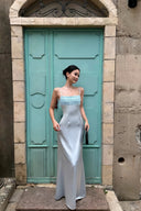 Full-length front view of the VOGSION Alicia light blue wedding guest maxi dress with shimmering beaded fringe