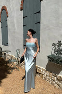 VOGSION Alicia light blue wedding guest maxi dress with beaded fringe in an outdoor Mediterranean setting