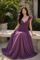 Purple bridesmaid maxi dress with full flowing skirt, seated garden view