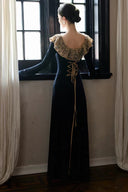 Back view of black lace-trim maxi dress with adjustable corset lace-up waist and long sleeves