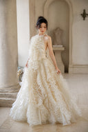 Champagne ruffle formal gown with halter neckline, three-quarter front view
