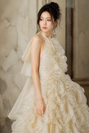 Champagne halter formal dress with fixed ruffle bodice and gold shimmer details