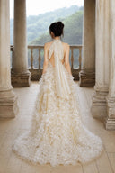 Open back champagne evening gown with adjustable halter tie, rear view