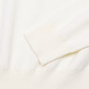 Close-up of Aveline ivory wool sweater ribbed cuff