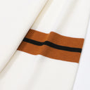 Close-up of Aveline ivory wool sweater sleeve stripes