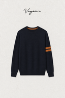 Front flat lay of Aveline navy wool crewneck sweater with caramel sleeve stripes
