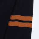 Close-up of Aveline navy wool sweater sleeve stripes