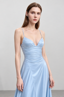 Close-up of Avelise light blue dress neckline and ruched waist detail