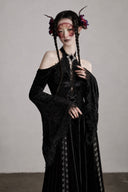 Gothic velvet dress detail with lace high neck, adjustable front ties and flared sleeves