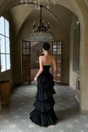 Back view of VOGSION Aveline black strapless ruffle maxi dress