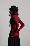 Black and red colorblock wool-blend turtleneck sweater, side and back view