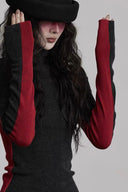 Black Gothic turtleneck and red colorblock extra-long sleeve close-up