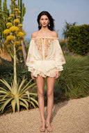 VOGSION butter yellow floral off-the-shoulder skort romper, full front view