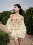 VOGSION butter yellow floral romper with layered ruffle skort