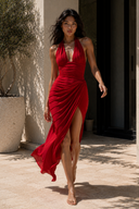 Flowing deep red chiffon halter maxi dress with thigh-high slit, corset-inspired bodice and elegant movement, perfect for evening parties, weddings and luxury vacations.